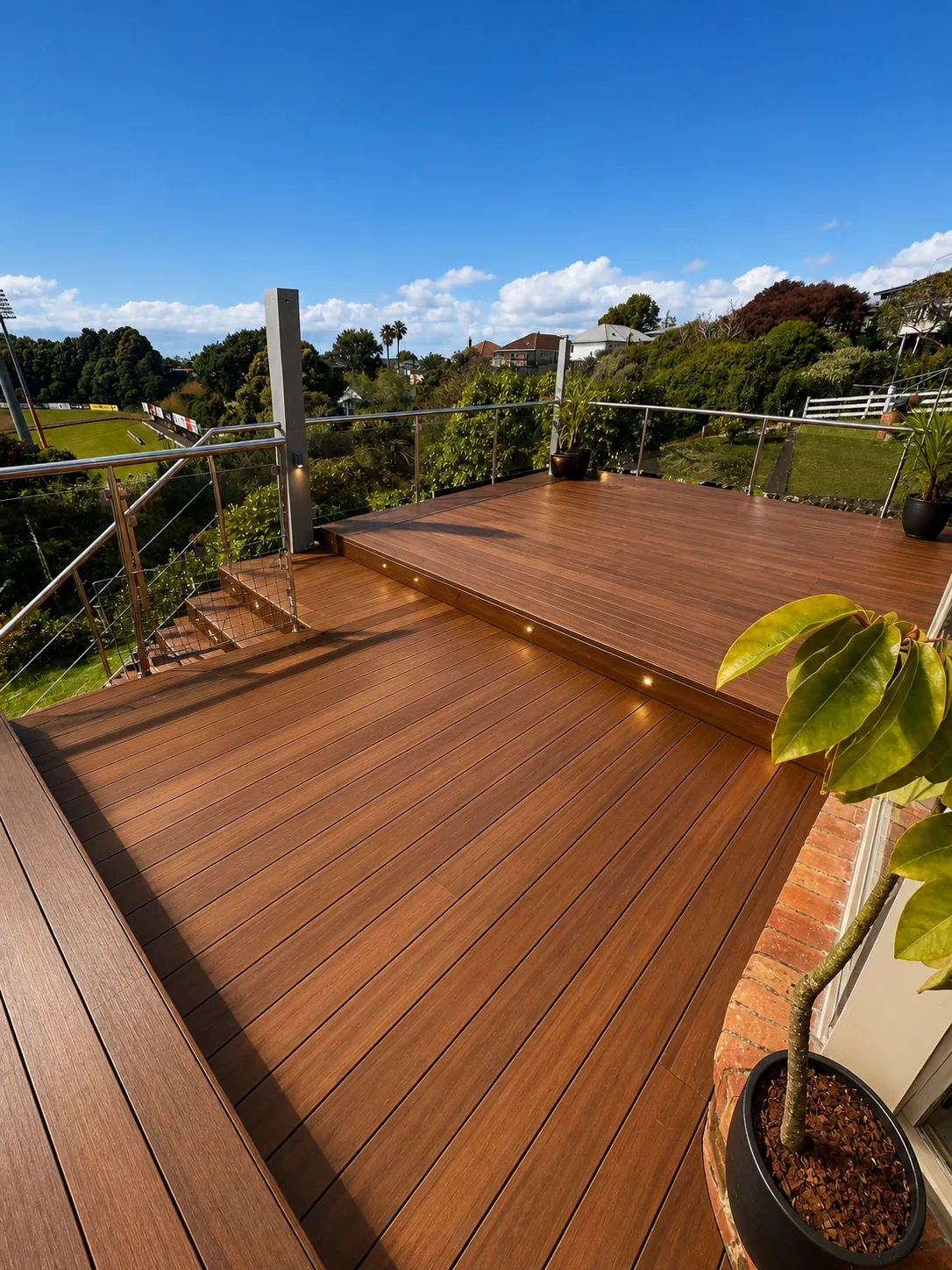 Elevated deck with glass balustrade, North Shore
